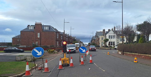 Road traffic management shown on a residential street