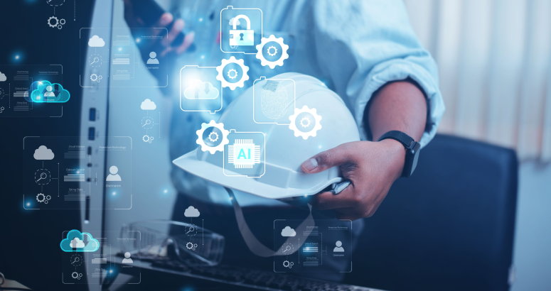 Man holding hard hat in front of computer 
