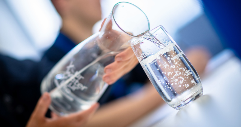 Pouring water into glass