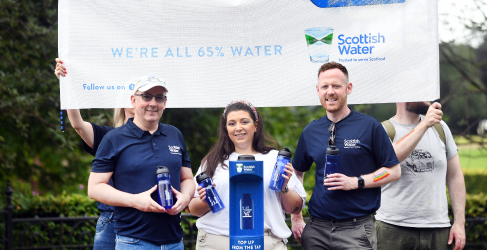 Scottish Water employees gather at Top Up Tap on Glasgow Green