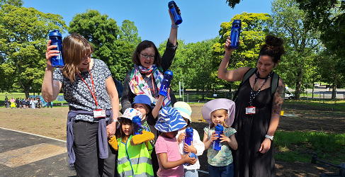 A group of school pupils and their teachers at the meadow planting event